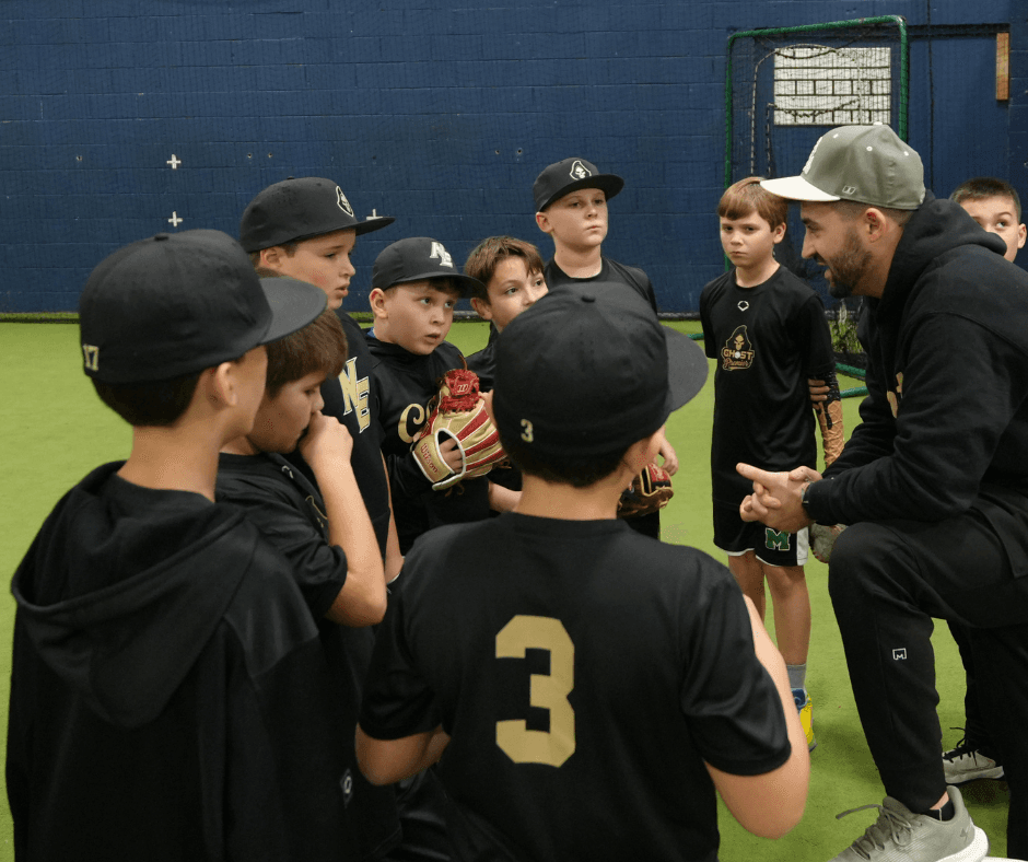 Ghost Premier coach instructing youth baseball team at Atlantic Sports Performance