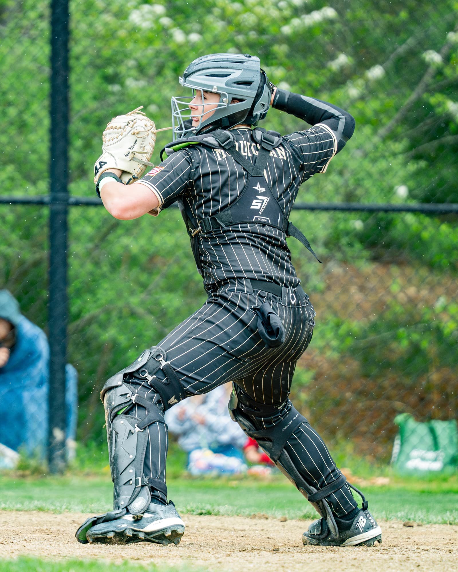 Ghost Premier catcher in full gear, post-throw