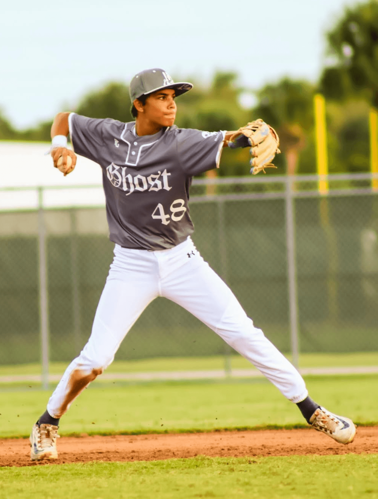 Ghost Premier infielder making a throw